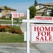 foreclosure-home-for-sale-signs-in-a-street