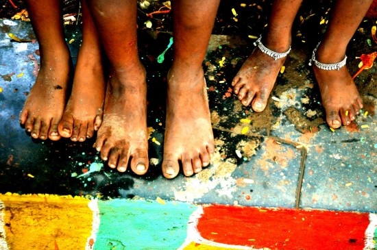 People's feet in an slum in India