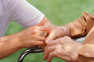 Holding Elderly Person's Hand
