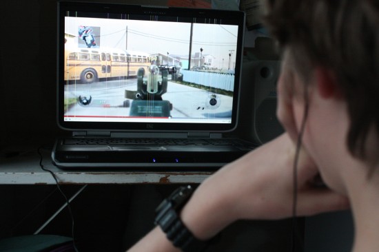 Author's son playing video games © Darcy Rhyno