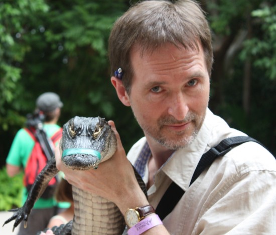 Darcy Rhyno with baby alligator at Jungle Island.