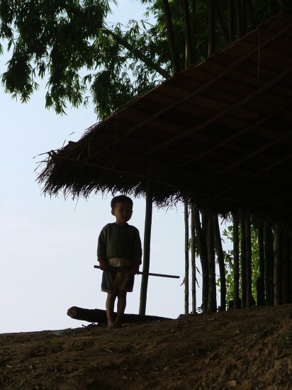 Laos:  Mekong River Xieng Maen village boy by Vincent Ross