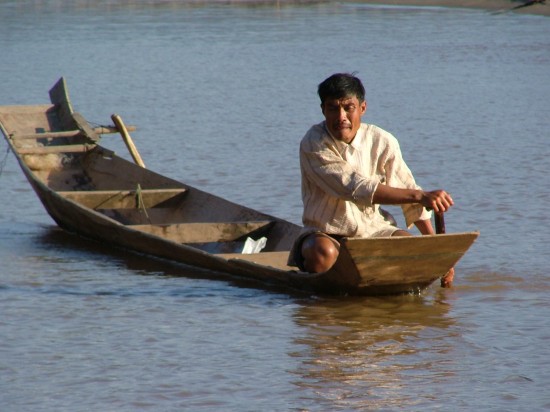 Laos Mekong River boatman Picture by Vincent Ross