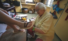Zora Galvin of St. Thomas makes handcrafted sandals that take two days to complete and keep customer coming back. © Sandra Phinney