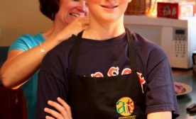 A mom helps prep her chef son for cooking