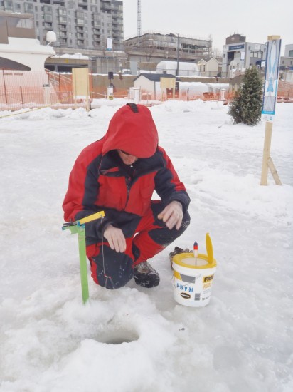 My guide, Mark, setting up ice fishing gear on the St. Lawrence River