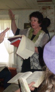 Karen Willard leads a song