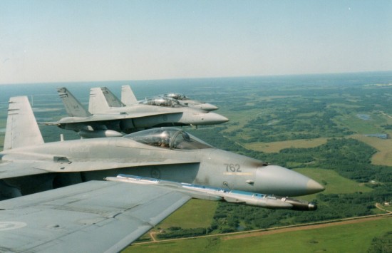 The other three CF-18A/Bs in the four plane strike package during the live-fire (bombs, missiles, 20 mm cannon) air-to-ground exercise at Jimmy Lake Range, Canadian Forces Base Cold Lake, Alberta. The pilots in the other aircraft were from Britain, Germany and the Netherlands.