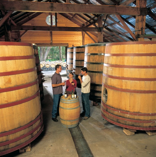 Couple with wine maker at Cape Mentelle winery, near Margaret River