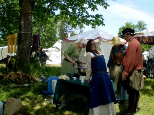 A cooking demonstration at an SCA event. These ladies are wearing more than underwear.