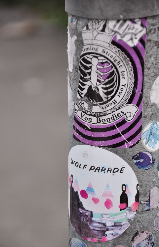 A carefully constructed collage encourages us to whimsy - in stark contrast to the cold metal which frames it.