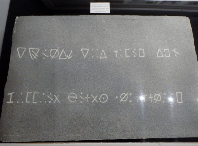 Replica of a mysteriously inscribed stone found within the Oak Island money pit.