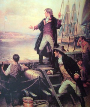 Francis Scott Key standing on boat, with right arm stretched out toward the United States flag flying over Fort McHenry, Baltimore, Maryland.