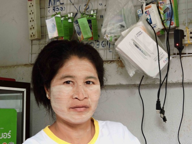 Woman in Myanmar with thanaka on her face