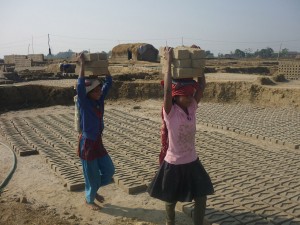 Nepali girls working in brick factory. Thousands of children work as bonded labourers in Asia, particularly in the Indian subcontinent.