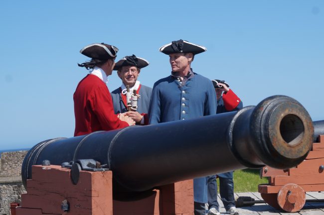 Preparing to fire an 18th Century French cannon.